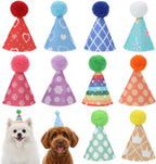 Various colored mini hats with pom poms for pet grooming
