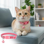 Removable silver identification chime bell attached to the pink pet accessory.