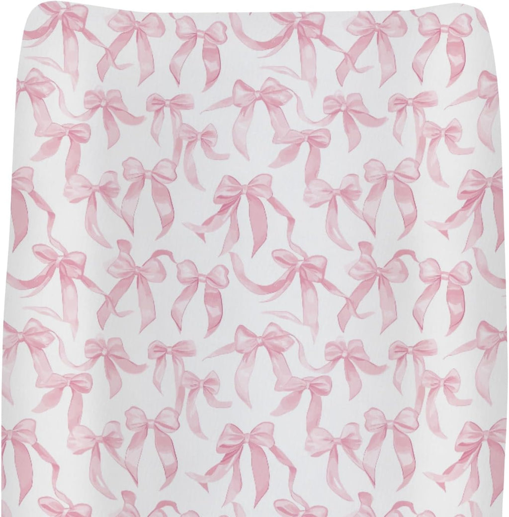 ZoUbqchY baby changing pad cover front view with pink bows pattern.