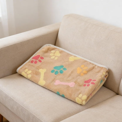 Lightweight puppy blanket spread across a modern domestic pet bed.