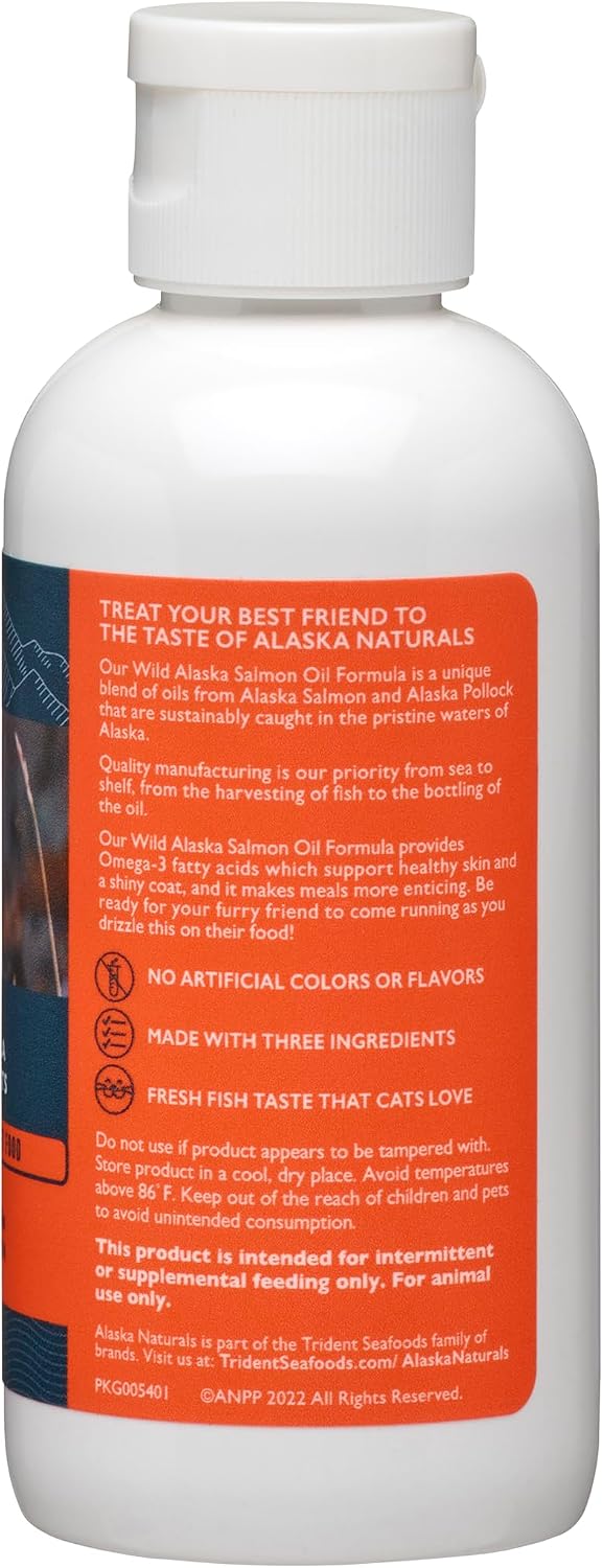 Liquid Omega 3 fish oil supplement for cats being pumped onto dry kibble cat food.