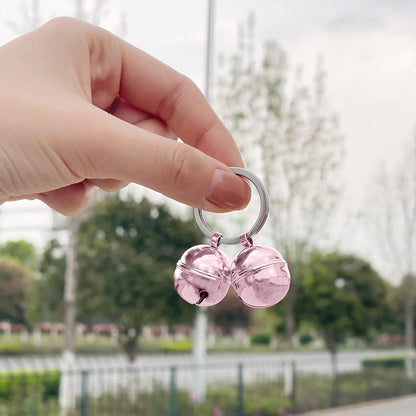 Handmade rust proof pink cat collar bells showcasing the 0.8 inch diameter metal design.