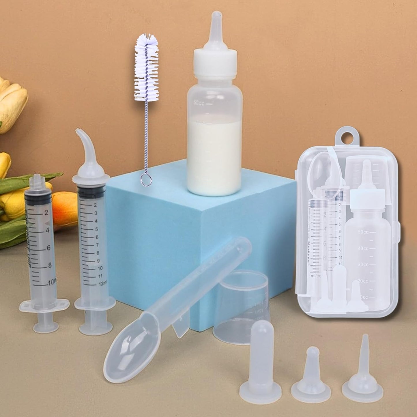 Hatelipet BPA-free formula dispenser syringe being prepared for newborn kitten nursing.