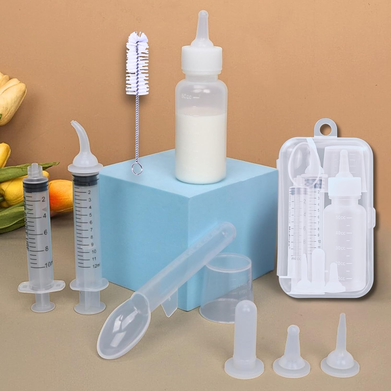 Hatelipet BPA-free formula dispenser syringe being prepared for newborn kitten nursing.