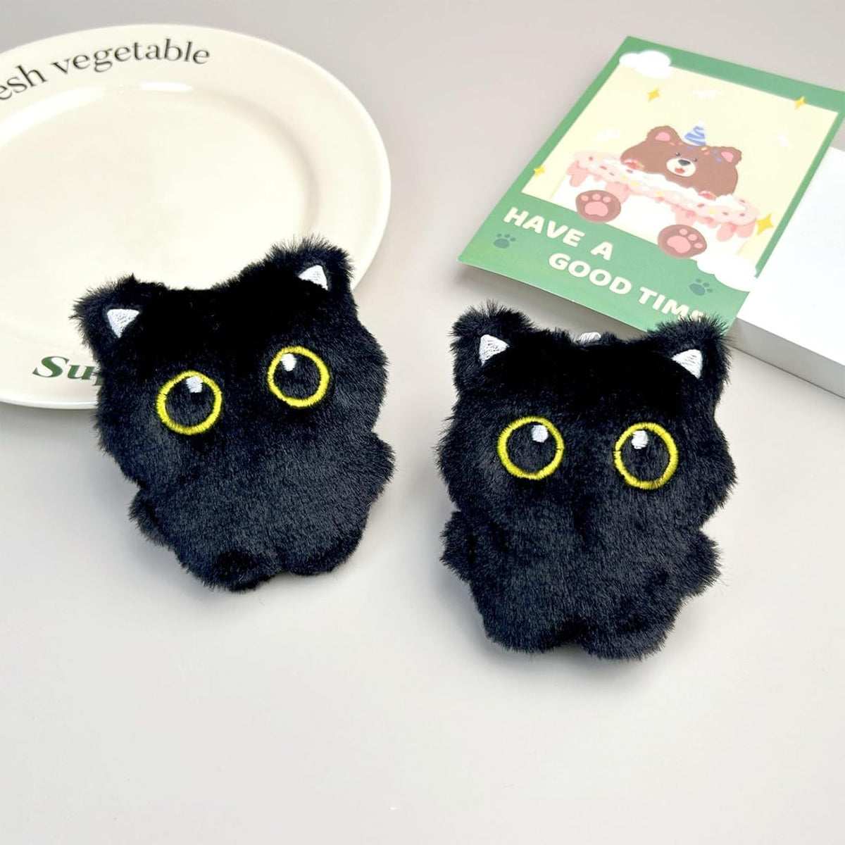 Side profile of the 3.9 inch imported black cat stuffed animal pet toy