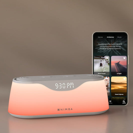 Nimba OFLO sunrise alarm clock front view displaying glowing warm light therapy mode