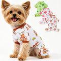 Dinkinty dog pajamas front view showcasing the cute monkey pattern on a small puppy.