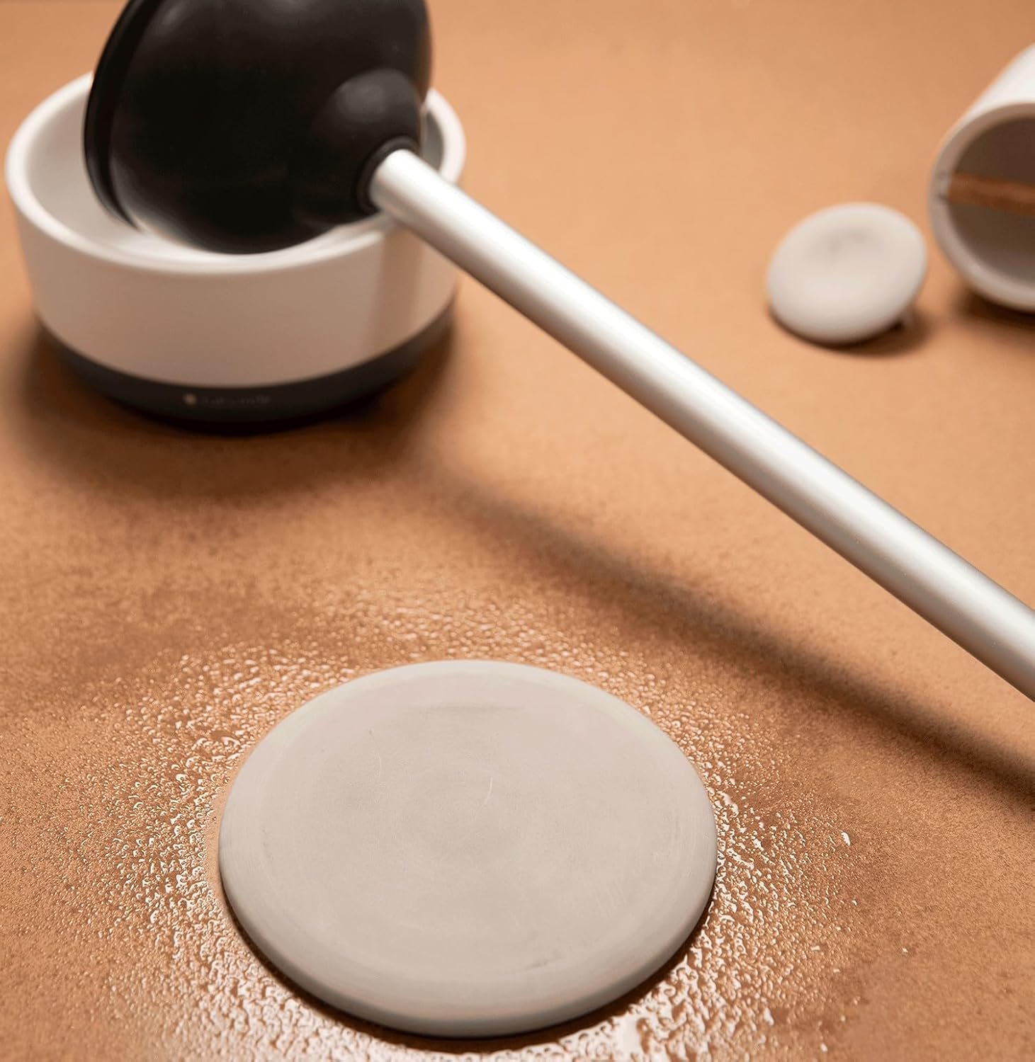 Natural silica moisture absorbing disk by Full Circle for bathroom hygiene