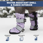 Adjusting the dual Velcro straps and toggle closure on the dog hiking boots.