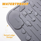 Ondware durable flexible silicone mat being rinsed clean with water.