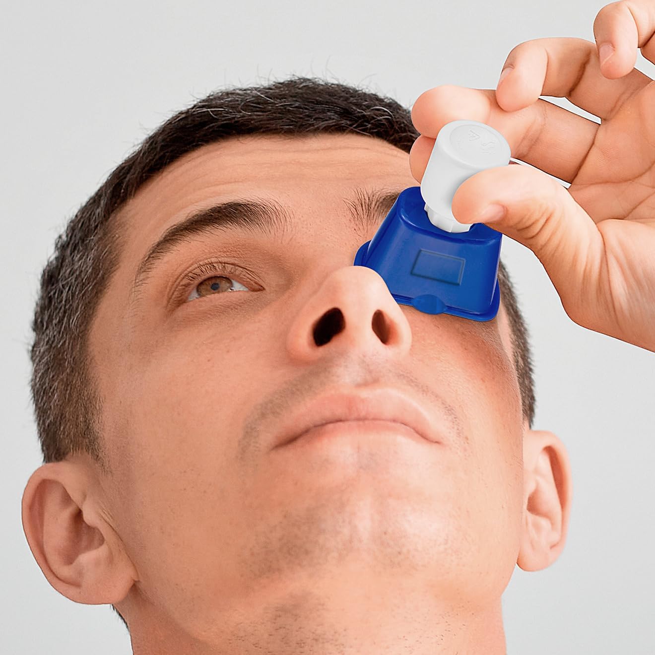 Peermax Drop Smart Eye Drop Guide front view showing the ergonomic medical dispenser design.