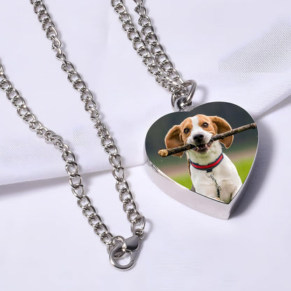 HJX heart urn locket for ashes displayed with included miniature filling funnel and steel needle