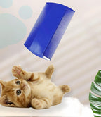 Pet owner using Yumflan grooming comb on cat fur