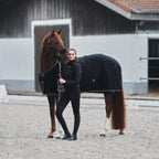 Black horse cooling blanket with cross surcingles and contrast piping details