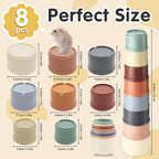 A complete eight piece set of small animal nesting cups arranged neatly from largest to smallest diameter.