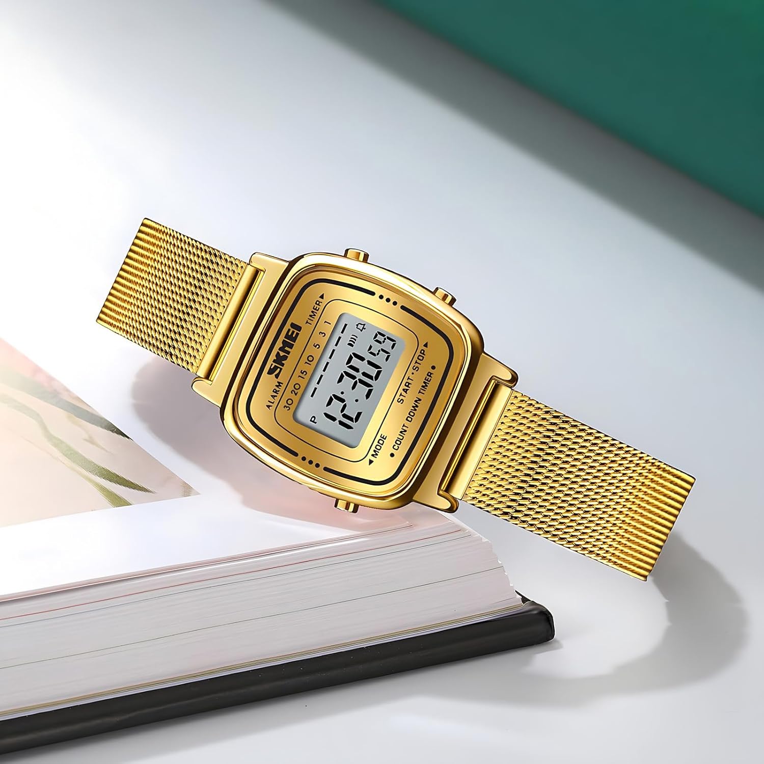 Detailed shot of the silver toned Milanese style stainless steel mesh bracelet and adjustable clasp.