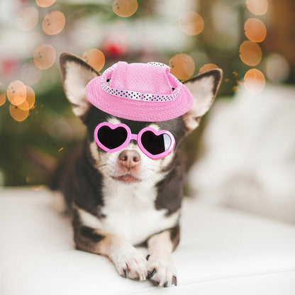 Cute puppy wearing pink choyaxo sun hat and UV protection goggles