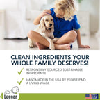 Hand holding 4Legger natural dog shampoo bottle