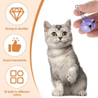 A small puppy wearing a collar accessorized with a bright pink Exclaith pet tracking bell.