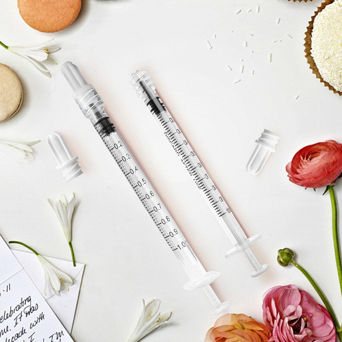 A selection of fifty individual sterile blister packs containing clear one milliliter syringes.