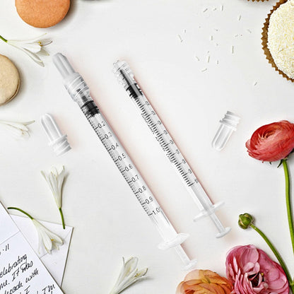A selection of fifty individual sterile blister packs containing clear one milliliter syringes.