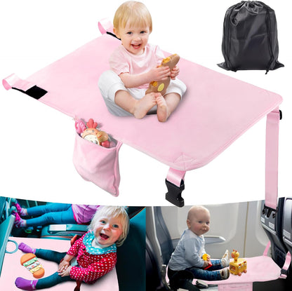 AWAHITAWA Toddler Airplane Bed in pink velvet installed as a seat extender on an aircraft row.