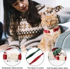 Close-up of the cat-faced quick-release safety buckle on the holiday kitten collar.