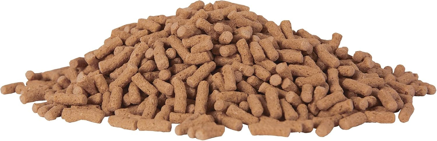 Close up of floating pond fish food sticks