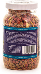 Close-up of floating vitamin-enriched pellets and insects