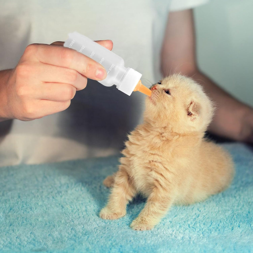 Snorbirell brand small pet milk nursing syringes laid out flat with replacement accessories.