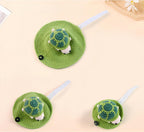 Back view of the tortoise clothing highlighting the cute miniature stuffed turtle detail