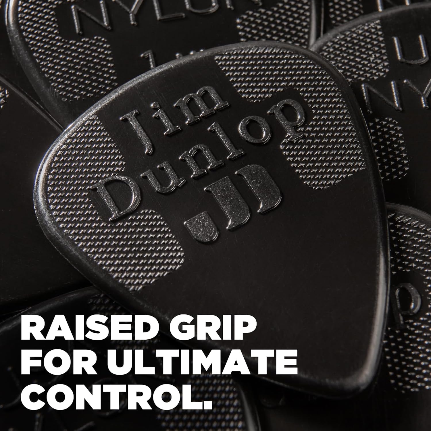 Jim Dunlop 44P38 nylon plectrums showing the raised tactile logo grip surface.