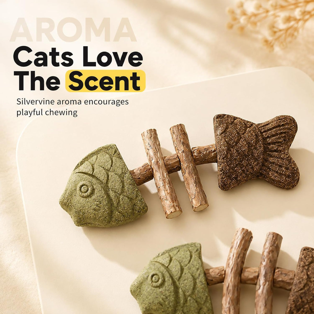 British Shorthair kitten playing with silvervine fish chew toy