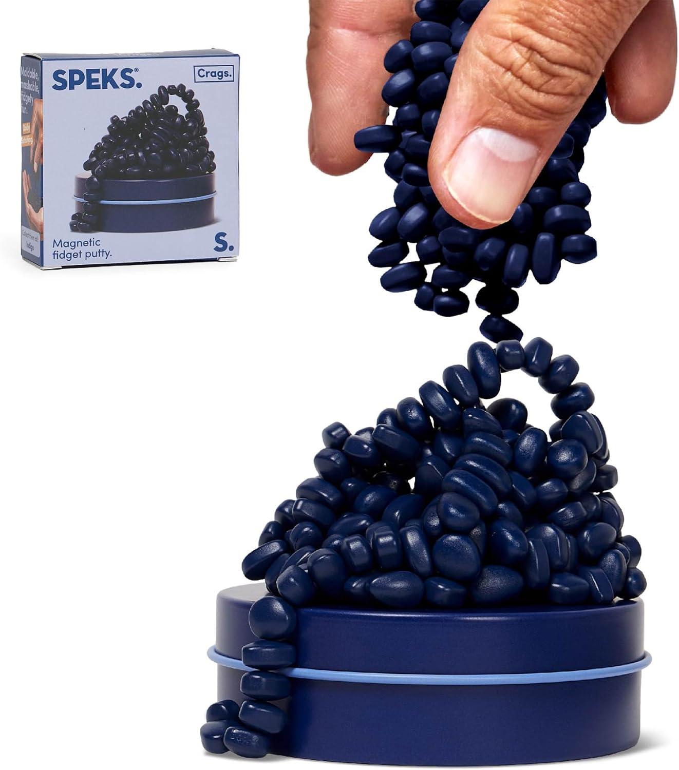 Speks Original Crags Ferrite Putty matte indigo stones stacked outside the metal tin front view