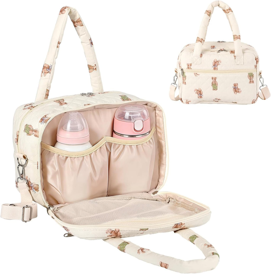 VerveBaby wearable breast pump bag front view showing beige quilted cotton material and cartoon prints