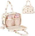 VerveBaby wearable breast pump bag front view showing beige quilted cotton material and cartoon prints