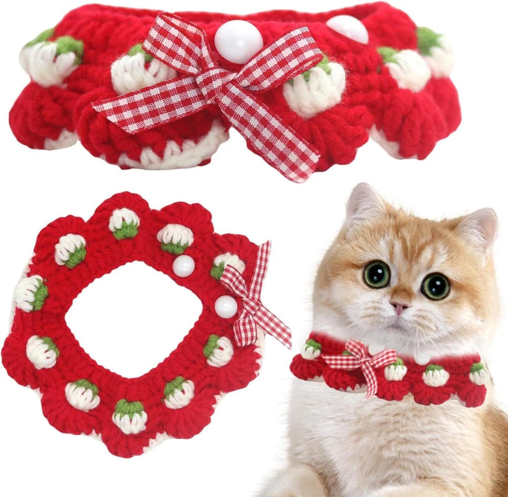 Aoeeki handmade white crochet pet bandana style collar showing the detailed craftsmanship of the strawberry charm.