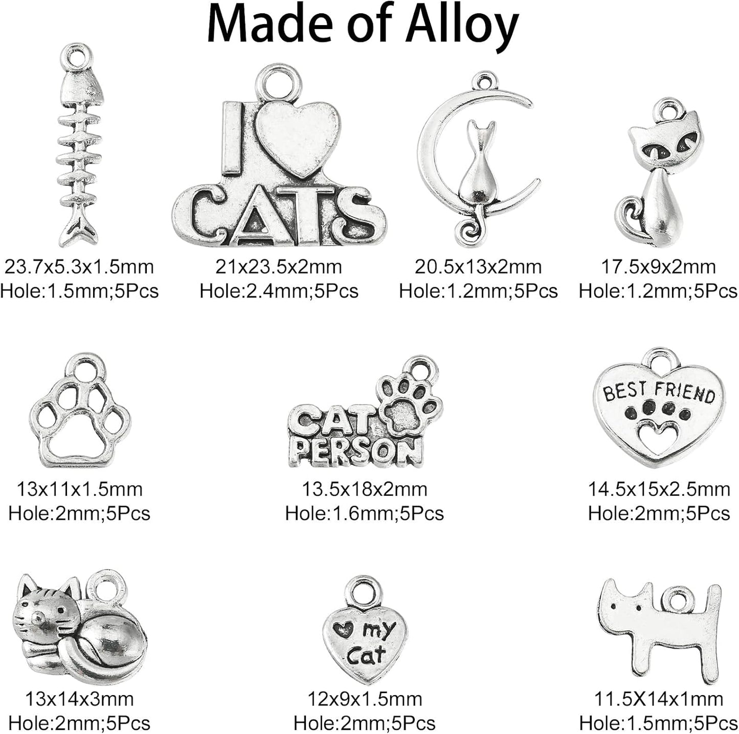 Variety of cat-themed Tibetan silver charms on a white background
