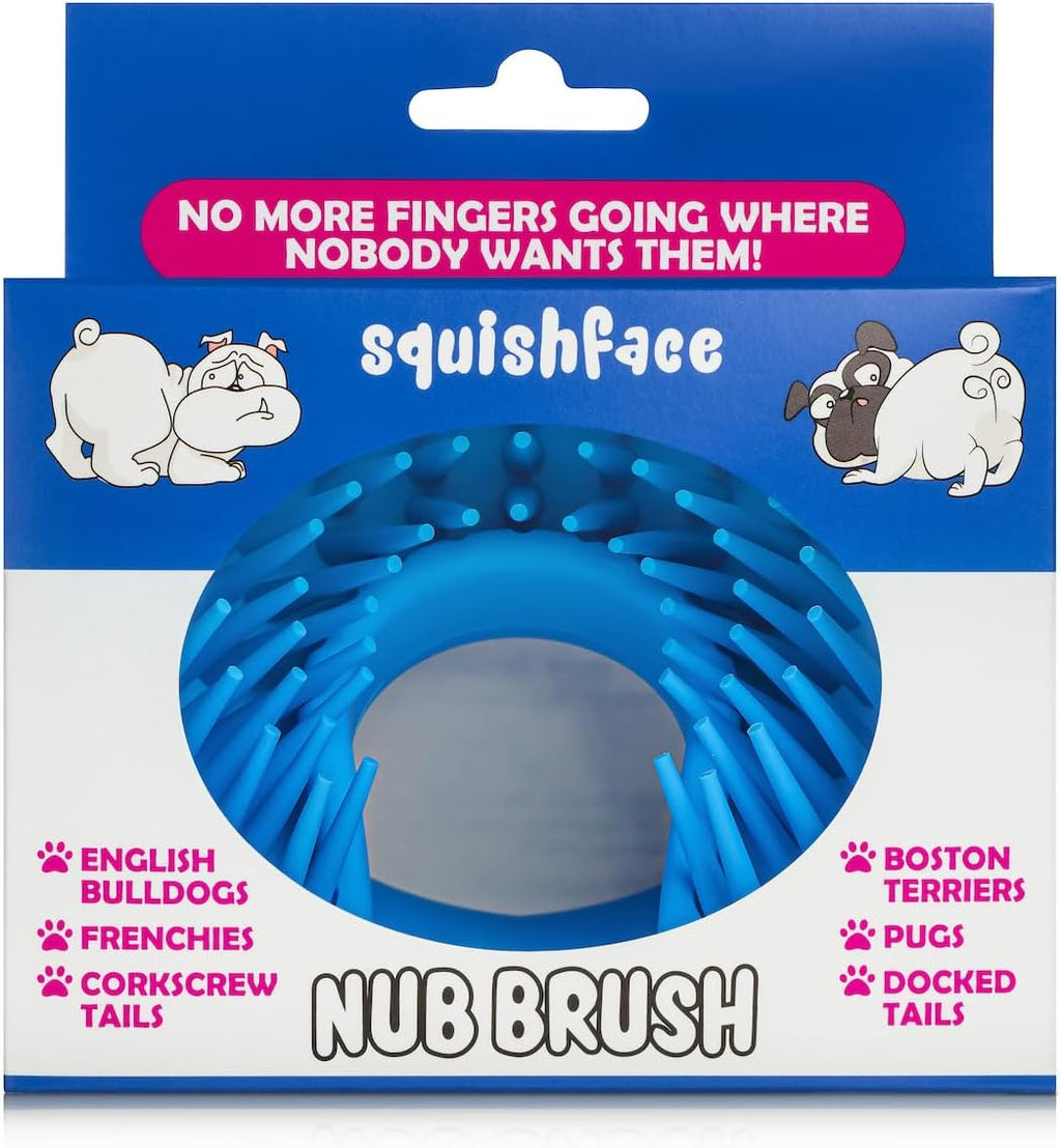 Squishface silicone grooming tool clearing debris from bulldog skin folds