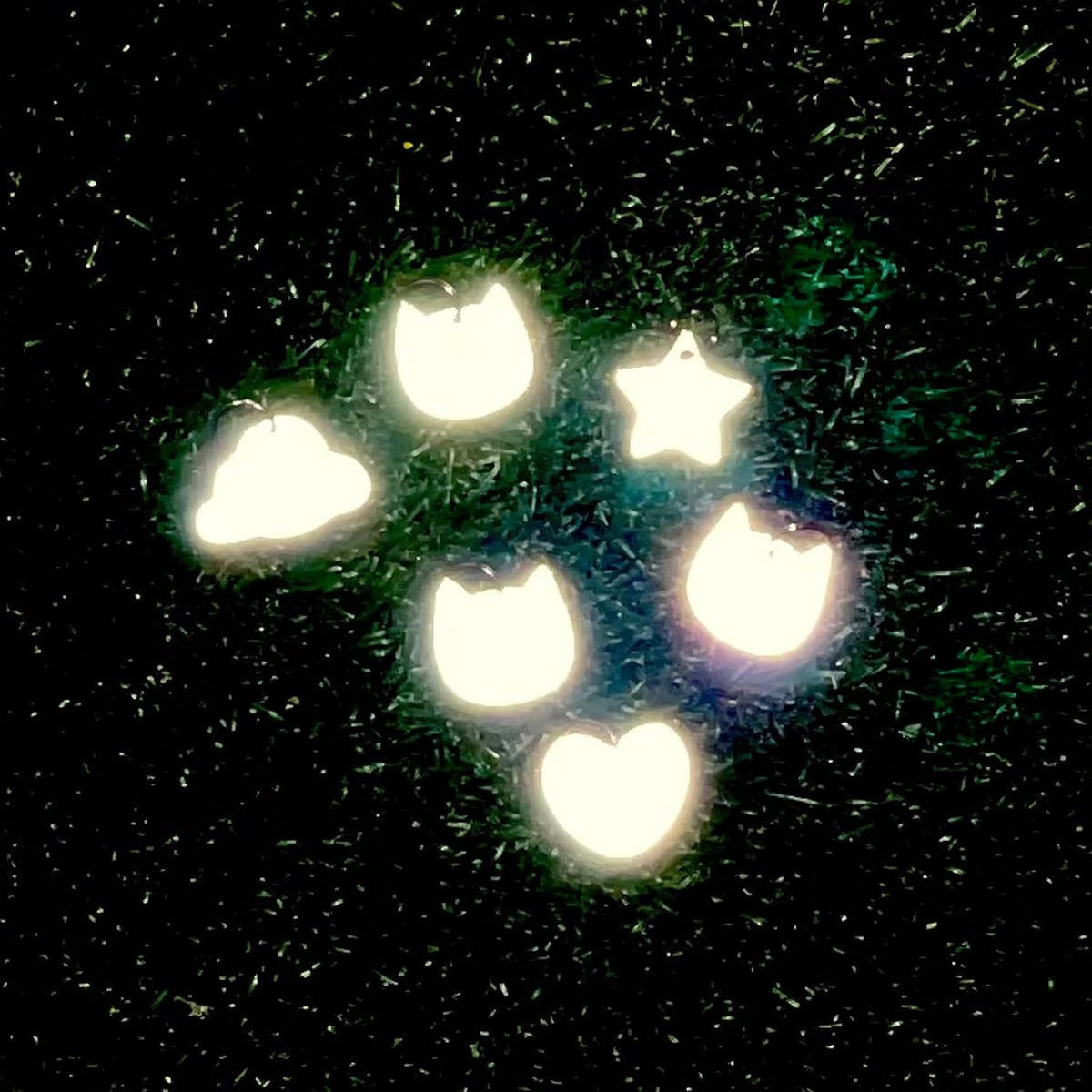 Reflective cat charm showing high visibility material