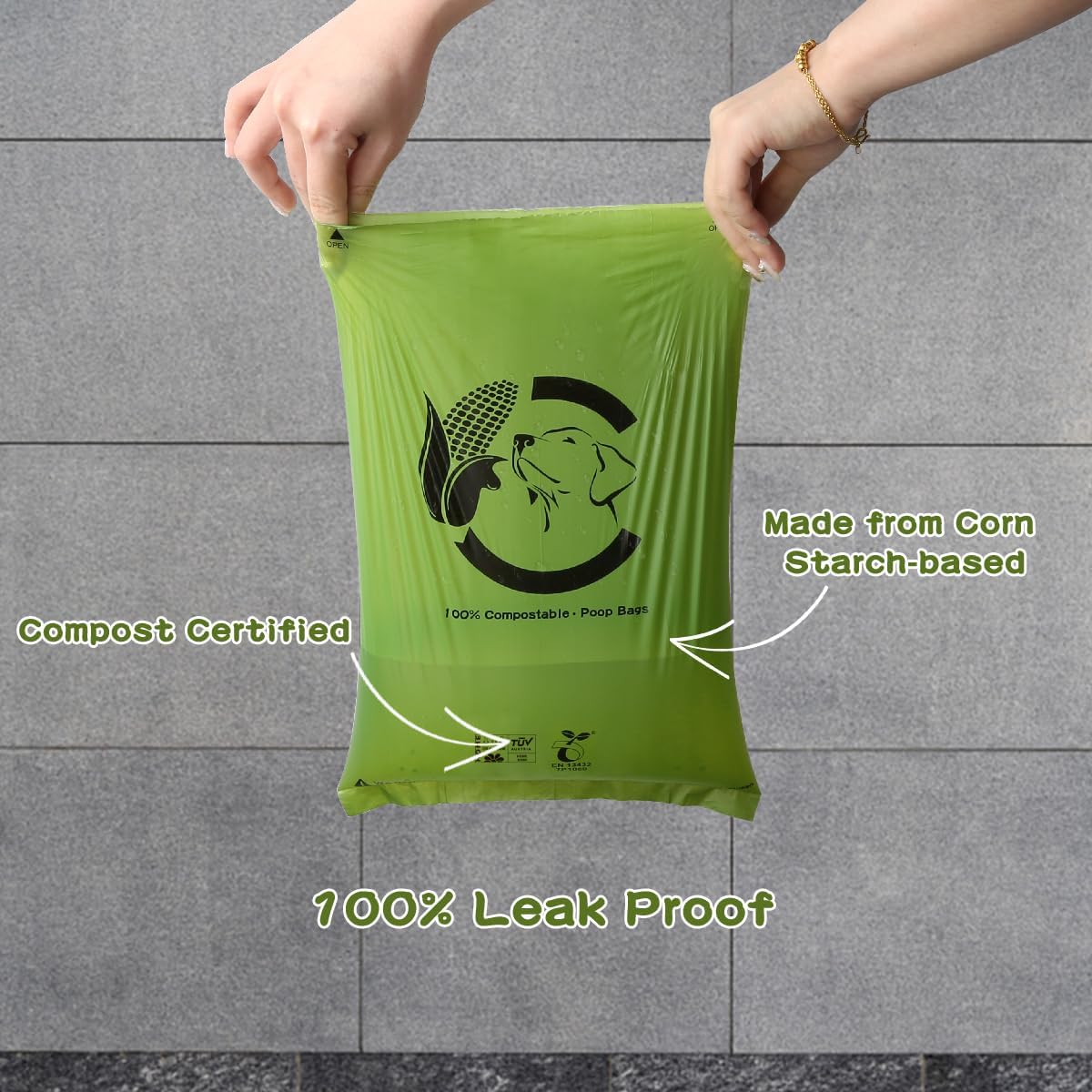 Forest green unscented compostable doggie bags being pulled from dispenser