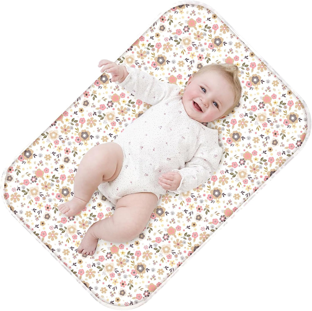 Phoebus Baby diaper changing pad front view showing the elegant floral pattern.