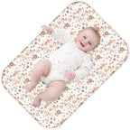 Phoebus Baby diaper changing pad front view showing the elegant floral pattern.