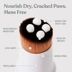 Dandylion dog paw lotion being applied to dry cracked dog paw pads with the mess-free brush
