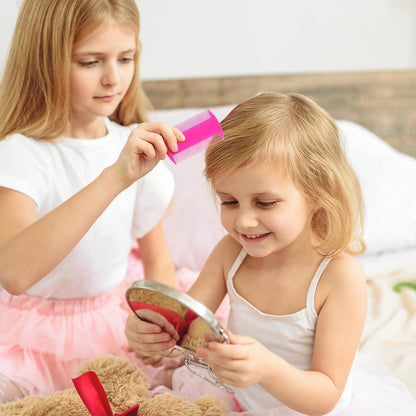 Pumtus plastic pet comb held in hand showing compact ergonomic size.