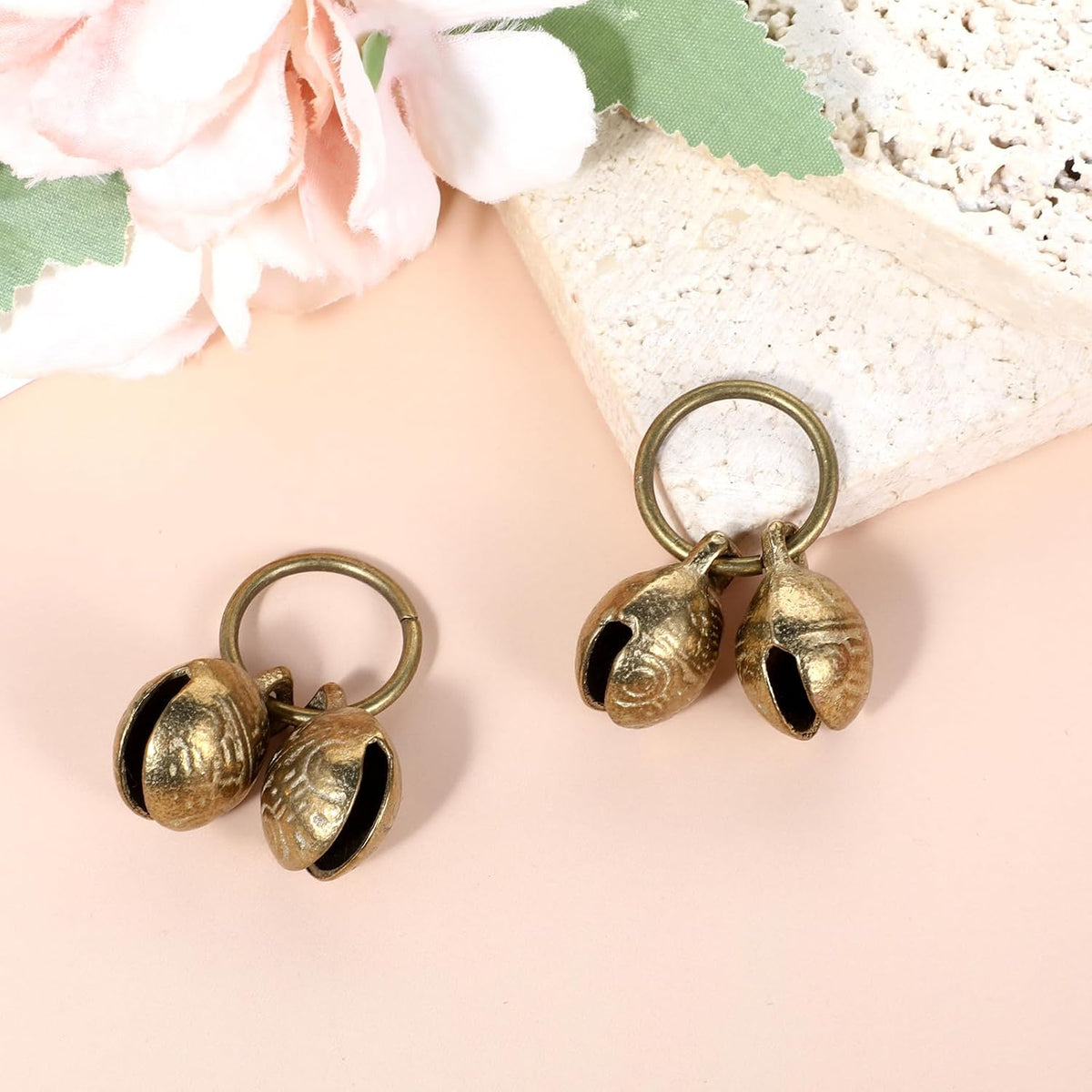 Close up view of the durable brass alloy construction of the Styquenzer pet bell.