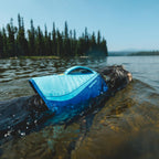 Water-compatible webbing and heavy-duty belly buckles on canine PFD