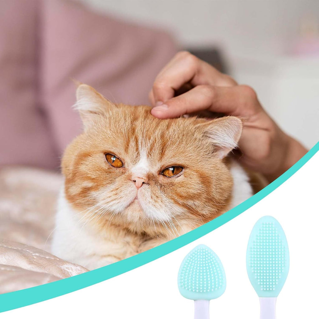 JJUNW silicone pet brush being used for gentle chin exfoliation and black seed cleaning on a cat