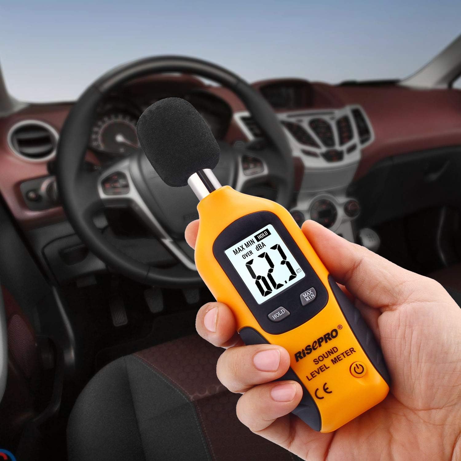 RISEPRO sound monitoring instrument displayed alongside its included black carrying pouch and premium packaging.