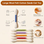 Cat playing with giant cotton swab interactive toy